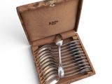 six spoons in a wooden box with a lid