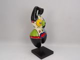 a small statue of a man with a hat on his head