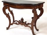 an image of a wooden table with a black marble top