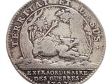gros plan d'une pièce de monnaie sur fond blanc