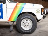 a white truck with a rainbow painted on the side of it