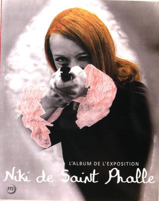 affiche française représentant une femme pointant une arme à feu vers le spectateur
