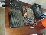 many pots and pans that are on the table