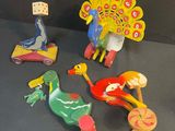 a lot of wooden toys that are sitting on a table