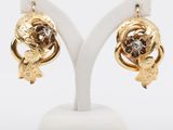 an image of a pair of gold and diamond earrings