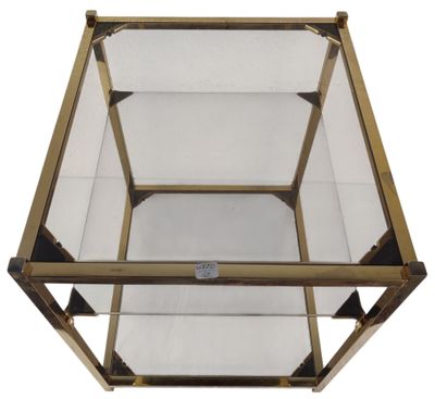 a close up of a glass and brass coffee table on a white background
