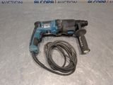 a close up of a corded drill with a cord attached to it