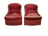 paire de fauteuils rembourrés rouges à franges