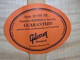 a label on the back of a guitar strings case