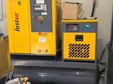 two air compressors sitting on top of a table