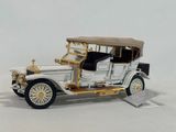a model of a white car with a brown roof