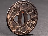a close up of a coin on a table with a black background