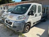 a picture of a white van parked in front of a building