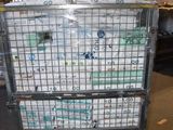 a large metal cart with a bunch of water bottles on it