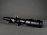 a close up of a rifle scope on a gray background