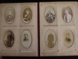 an old photo of a group of people sitting in a book