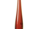 a red glass vase with a blue base on a white surface