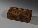 a small wooden box that has a sign on it