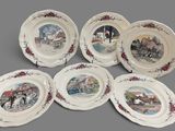 six plates with a picture of a train on them on a gray surface
