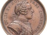 une vieille pièce de monnaie sur laquelle figure le buste d'un homme coiffé d'un turban