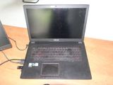 a laptop that is sitting on a desk with a mouse