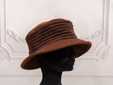 a mannequin wearing a brown hat on a mannequin head
