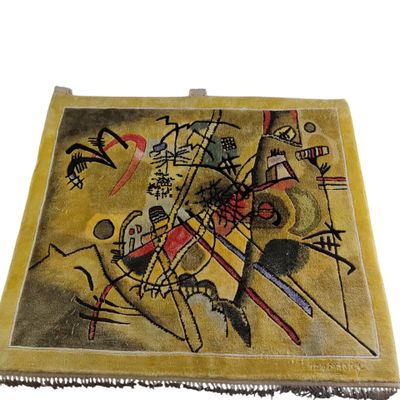 painting on the wall of a yellow area rug with a painting of a man on a horse
