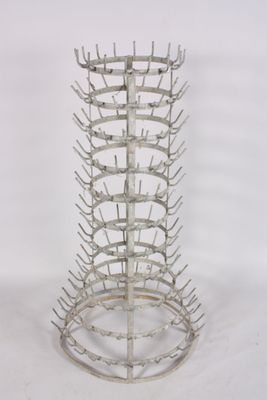a metal rack that has a bunch of bottles in it