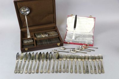 a lot of silverware in a case on the table