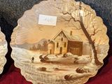 two plates with a picture of a house on them