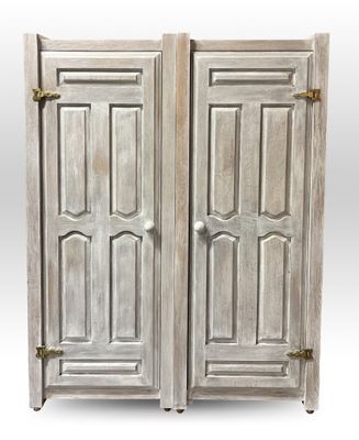 a pair of antique white painted wooden doors with brass hardware