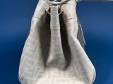 an image of a small white bag on a blue background