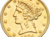 gros plan d'une pièce de monnaie sur laquelle figure une tête de femme