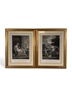 two framed prints of a woman and a man in a landscape