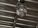 a light that is hanging from the ceiling of a building