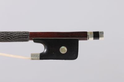a close up of a violin bow on a white background