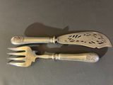 pair of antique silverware forks and spoons on a table
