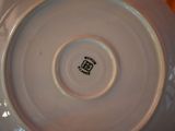 a white plate that has a black and white design on it