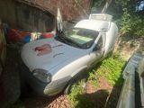 a white van that is parked next to a brick building