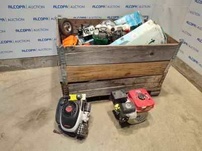 a wooden box filled with assorted items in front of a wall