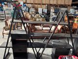 a lot of furniture in a warehouse with a lot of tools