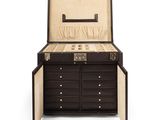an image of a black and white chest of drawers with a watch inside