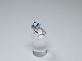 a ring that is sitting on top of a glass