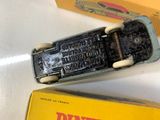a small toy car that is sitting next to a box