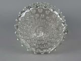 an image of a glass bowl on a table with a gray background