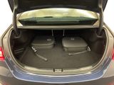 a trunk of a car with luggage in it