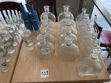 a table with a lot of bottles and glasses on it