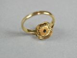 an image of a gold ring with a cat ' s head on it