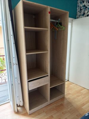 a closet with a shelf and a drawer in it