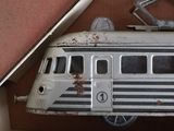 a toy bus that is in a box on the floor